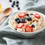 porridge-with-berries-in-a-bowl-royalty-free-image-1011949898-1559339734