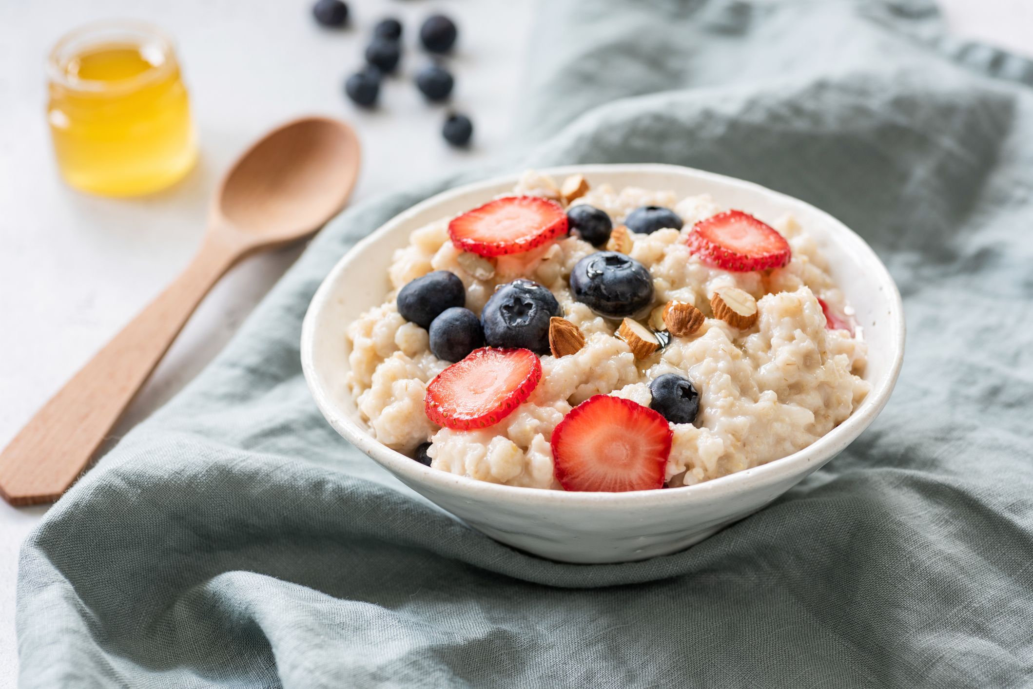 porridge-with-berries-in-a-bowl-royalty-free-image-1011949898-1559339734